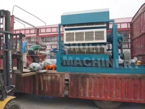 Loading the egg tray machine